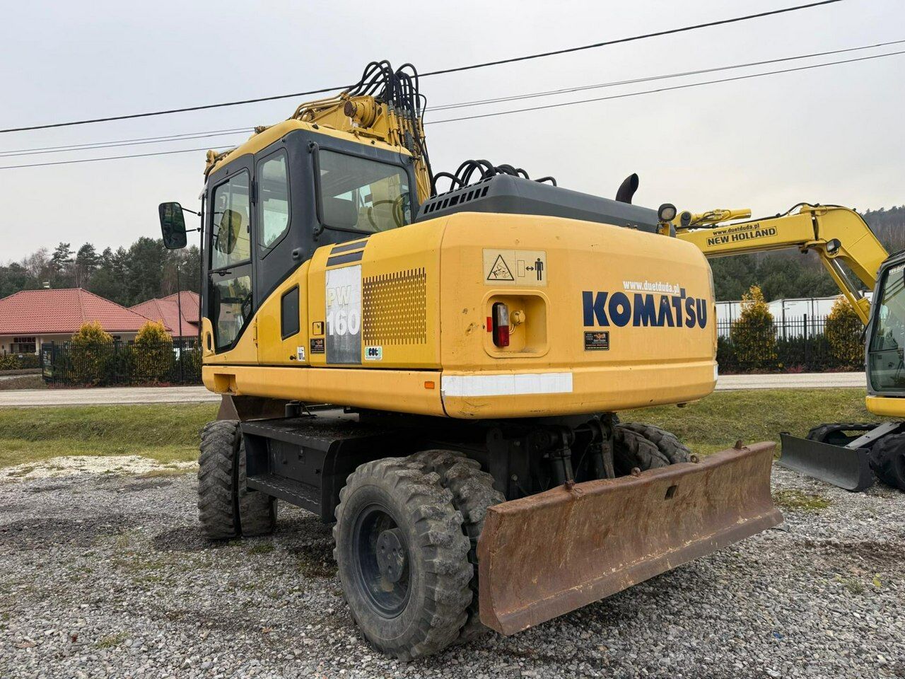 2009 Komatsu PW160-7E0 wheel excavator, rear three-quarter view 2009 Komatsu PW160-7E0 wheel excavator, rear three-quarter view