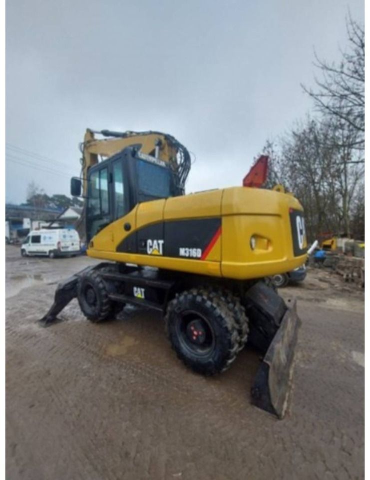 2007 Caterpillar M316D wheel excavator, rear three-quarter view 2007 Caterpillar M316D wheel excavator, rear three-quarter view