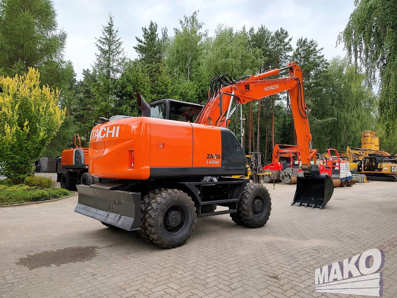 2016 Hitachi Zaxis 140W wheel excavator, rear three-quarter view