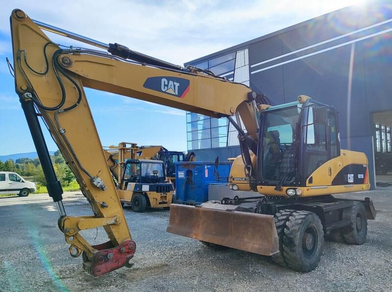 2009 Caterpillar M315D wheel excavator, front three-quarter view