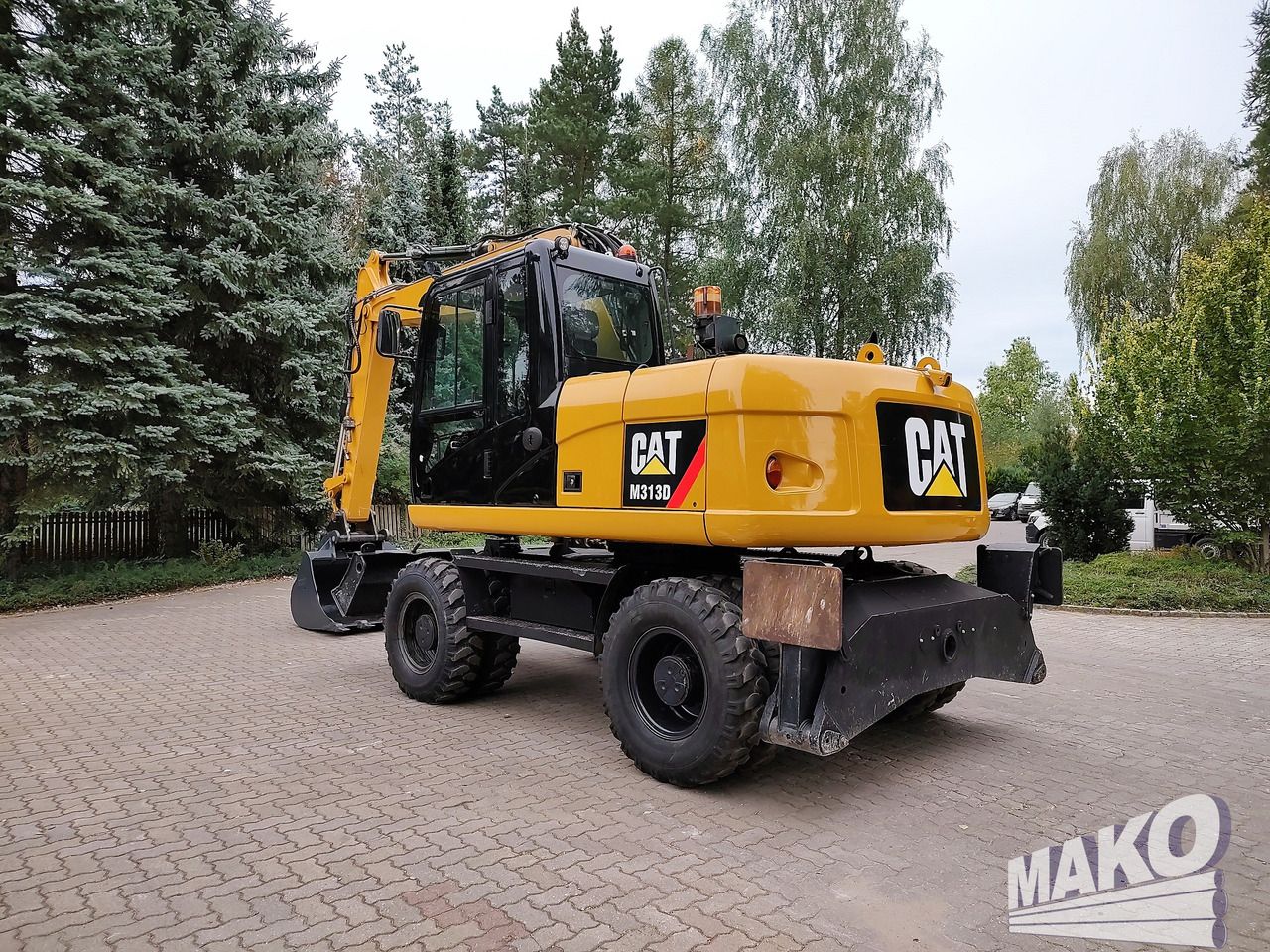 2012 Caterpillar M313D wheel excavator, rear three-quarter view 2012 Caterpillar M313D wheel excavator, rear three-quarter view