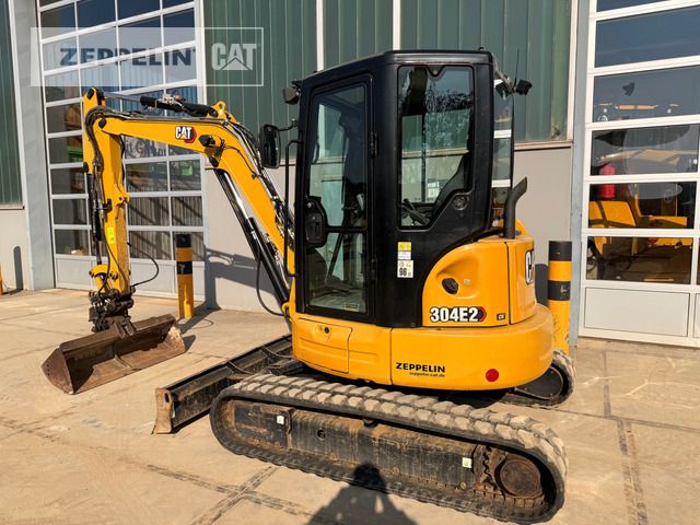 2021 Caterpillar 304E2 mini excavator, rear three-quarter view 2021 Caterpillar 304E2 mini excavator, rear three-quarter view