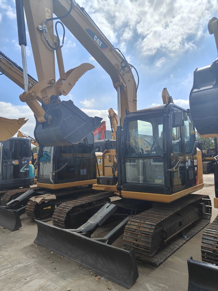 Caterpillar 308E crawler excavator, front three-quarter view Caterpillar 308E crawler excavator, front three-quarter view