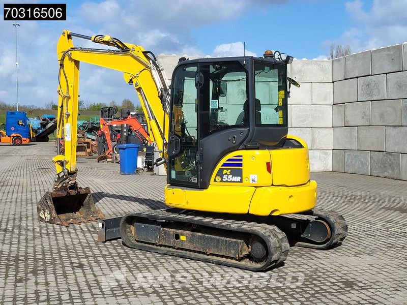 2024 Komatsu PC55MR-5 mini excavator, rear three-quarter view