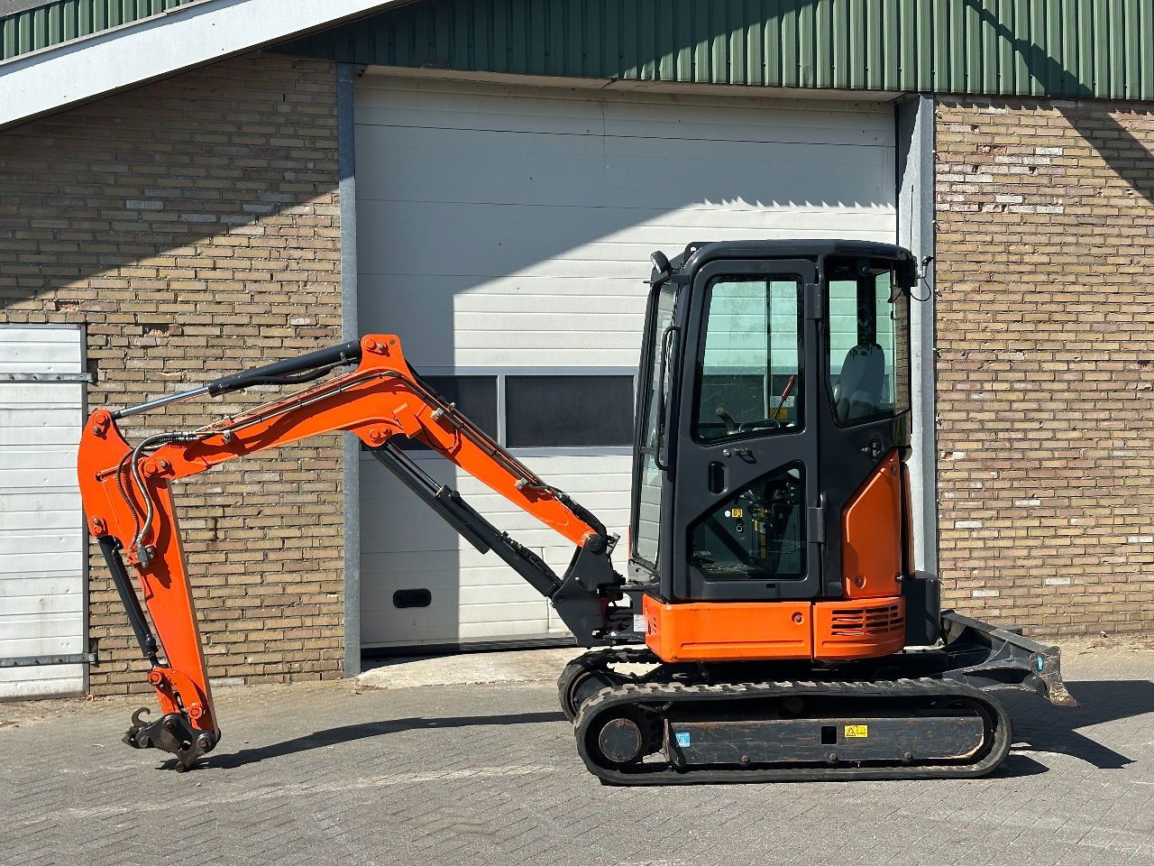 Hitachi ZX26U-6CR mini excavator, side view Hitachi ZX26U-6CR mini excavator, side view