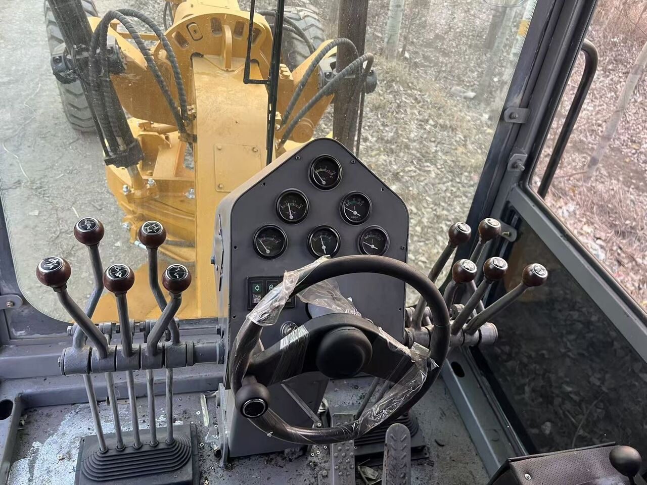 2025 Caterpillar 140K operator cab interior view