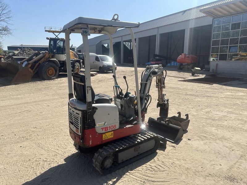 2013 Takeuchi TB108 mini excavator, rear three-quarter view 2013 Takeuchi TB108 mini excavator, rear three-quarter view
