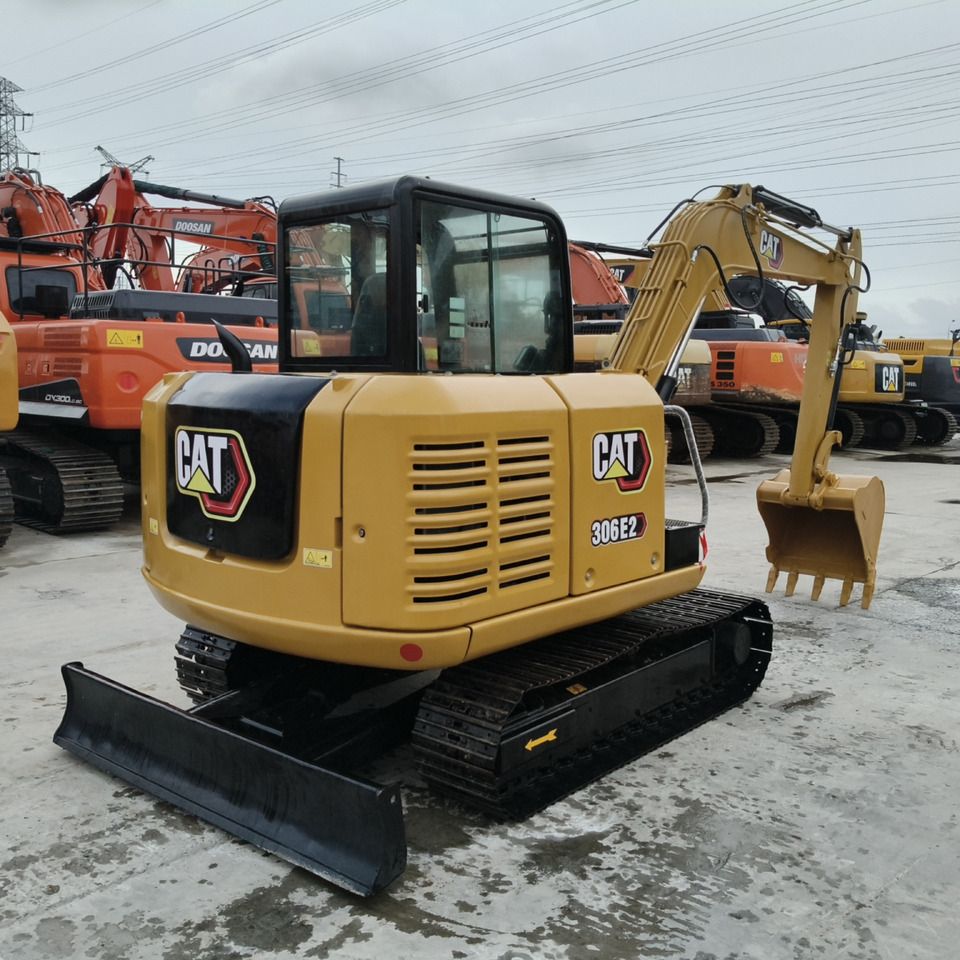 2023 Caterpillar 306E2 mini excavator, rear three-quarter view 2023 Caterpillar 306E2 mini excavator, rear three-quarter view