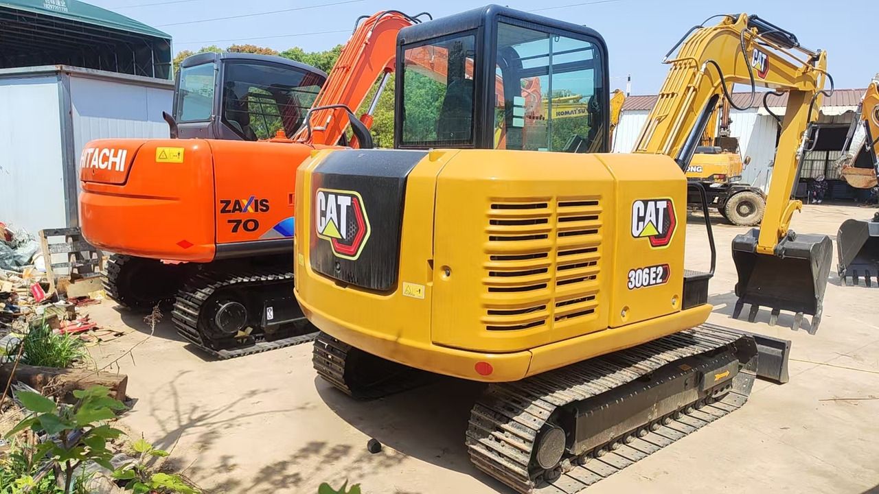 2018 Caterpillar 306E2 mini excavator, rear three-quarter view 2018 Caterpillar 306E2 mini excavator, rear three-quarter view