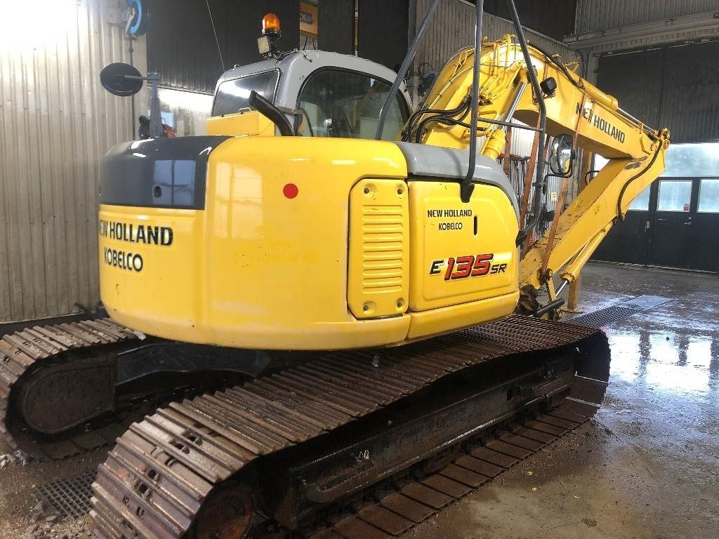 New Holland E135SR crawler excavator, rear three-quarter view New Holland E135SR crawler excavator, rear three-quarter view