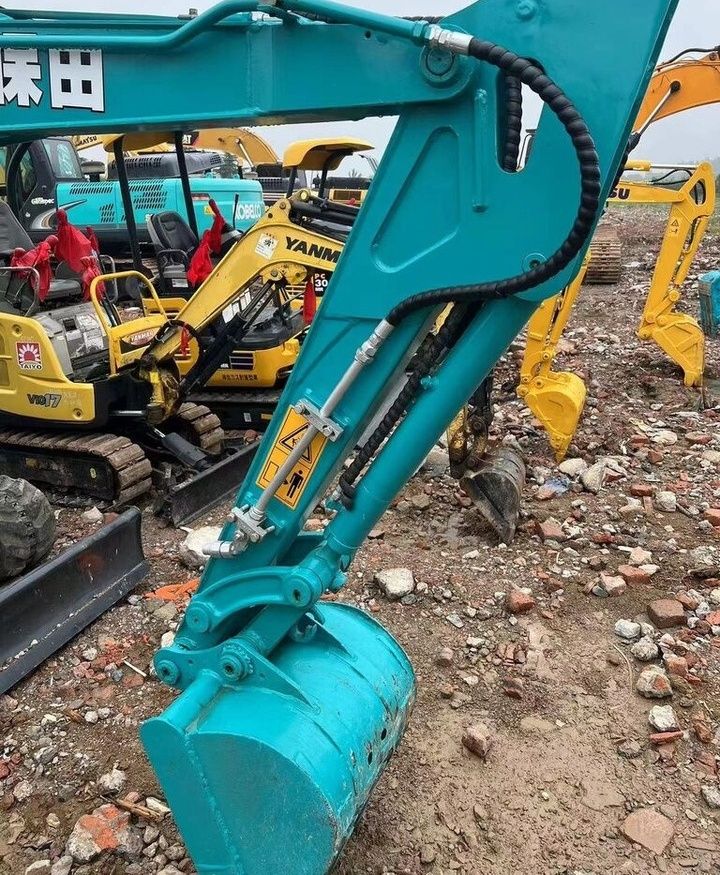 Kubota KX135 mini excavator boom and bucket detail Kubota KX135 mini excavator boom and bucket detail