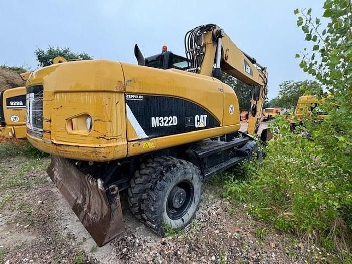 2012 Caterpillar M322D wheel excavator, rear three-quarter view