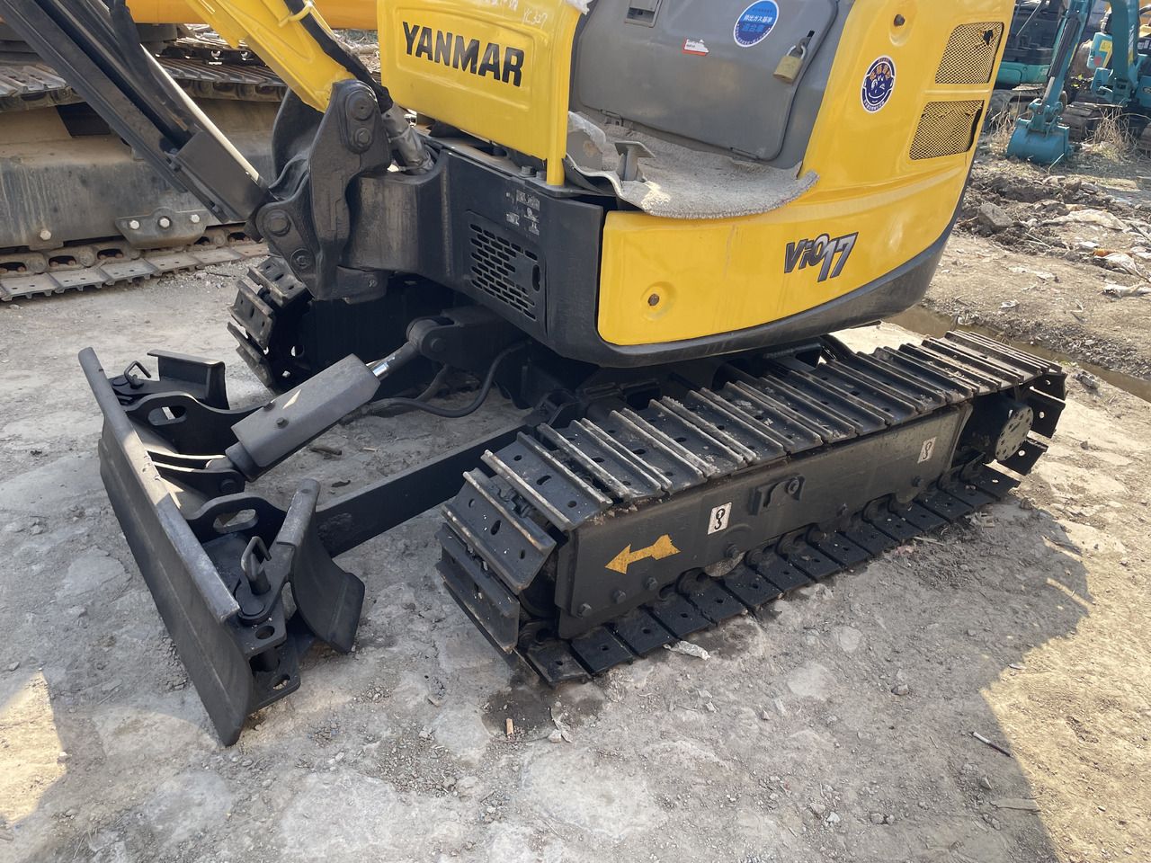 2022 Yanmar VIO 17 mini excavator, side view of undercarriage and blade