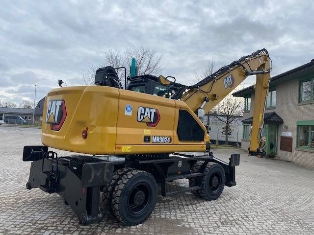 2024 Caterpillar MH3024-07D material handler, rear three-quarter view