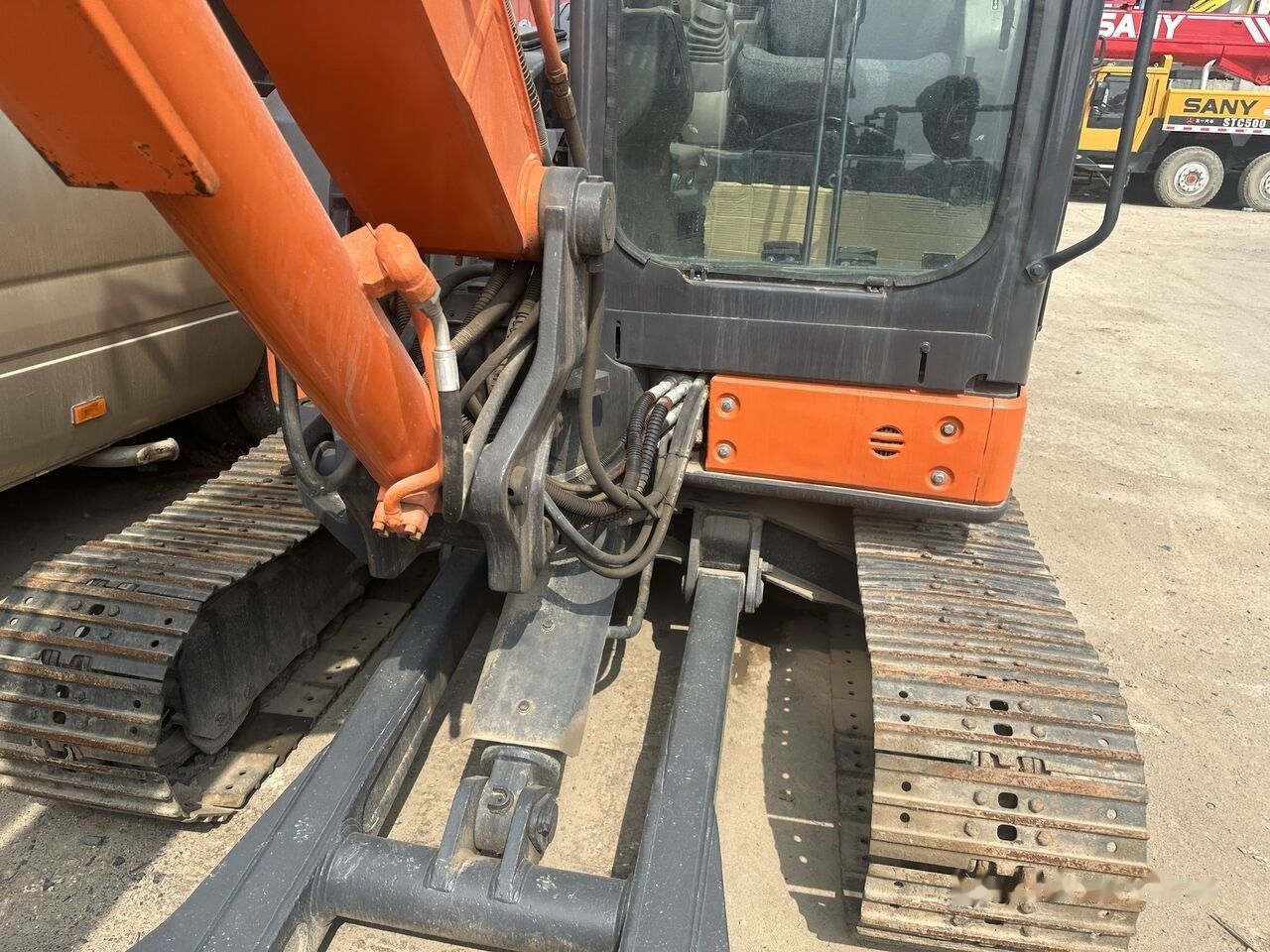 Hitachi ZX65 mini excavator, close-up of cab and boom Hitachi ZX65 mini excavator, close-up of cab and boom