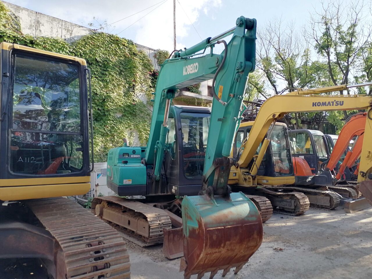 2024 Kobelco SK75-8 excavator, front three-quarter view