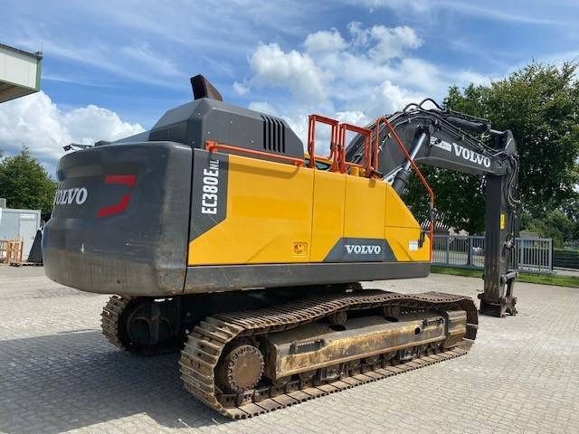2019 Volvo EC380ENL crawler excavator, rear three-quarter view