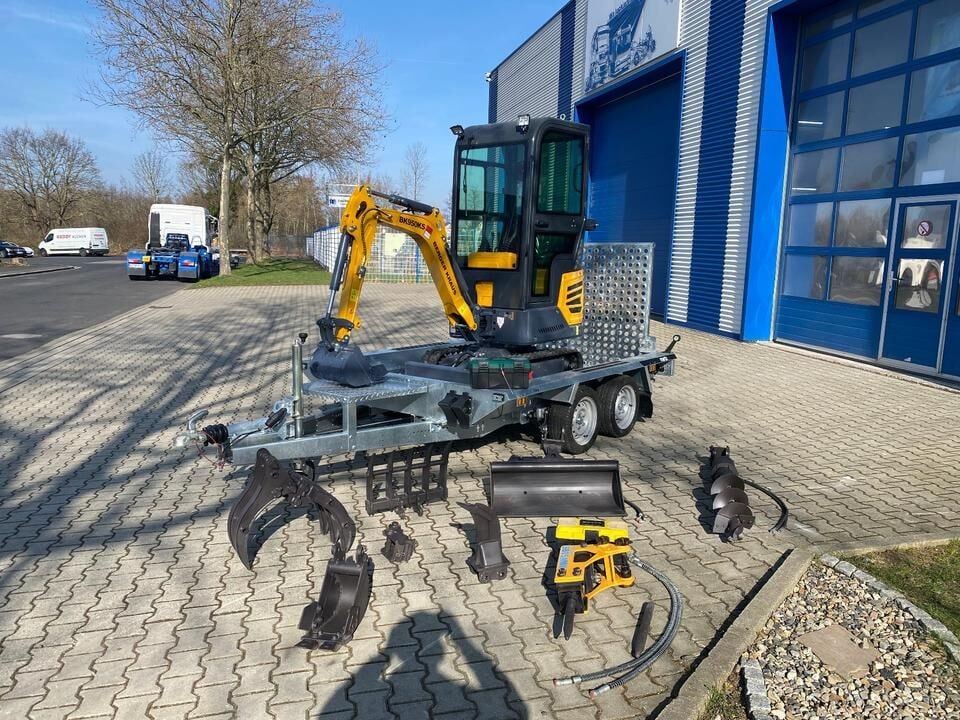 Berger Kraus BK950KS mini excavator on trailer with attachments