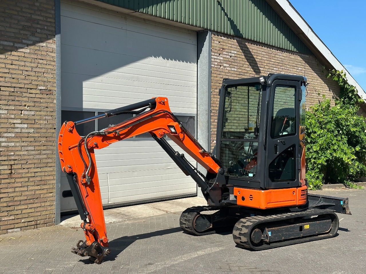 Hitachi ZX26U-6CR mini excavator, side view Hitachi ZX26U-6CR mini excavator, side view