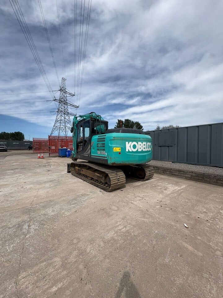 2022 Kobelco SK130LC-11DZ crawler excavator, rear three-quarter view 2022 Kobelco SK130LC-11DZ crawler excavator, rear three-quarter view