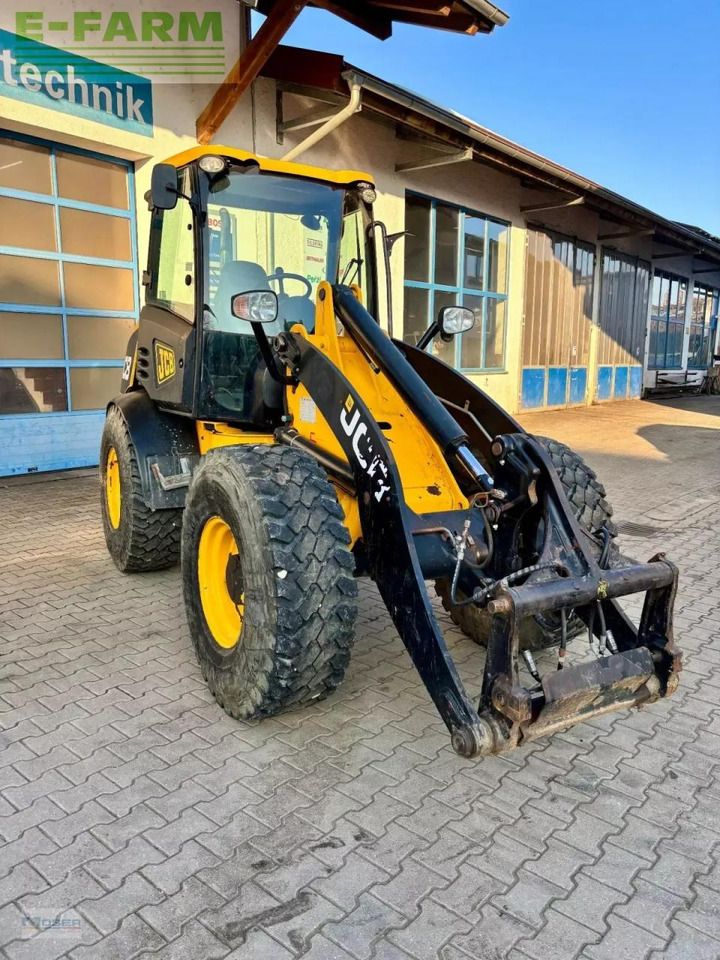 2011 JCB 409 wheel loader, front three-quarter view