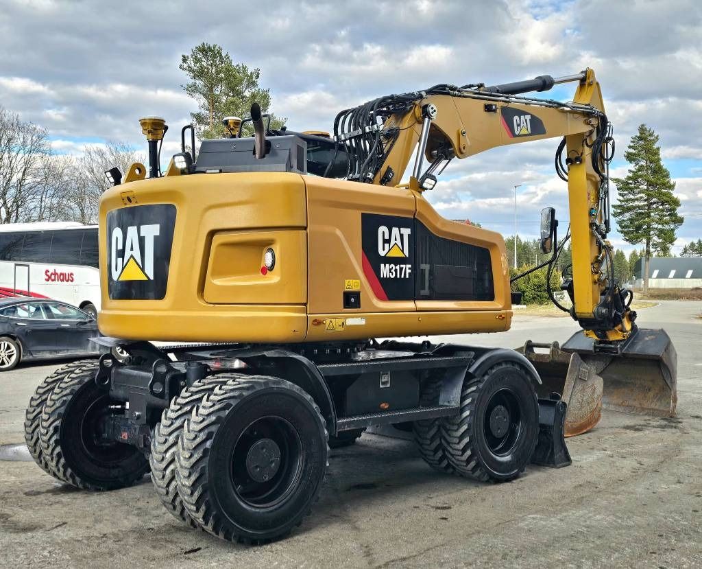 2017 Caterpillar M317F wheel excavator, rear three-quarter view 2017 Caterpillar M317F wheel excavator, rear three-quarter view