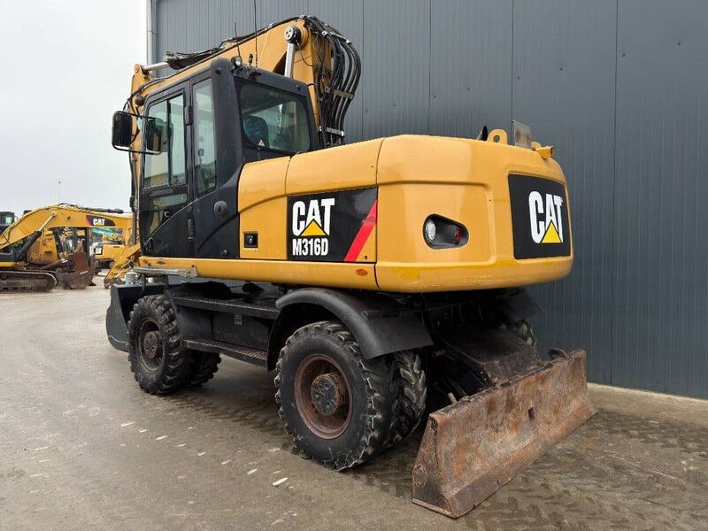 2011 Caterpillar M316D wheel excavator, rear three-quarter view