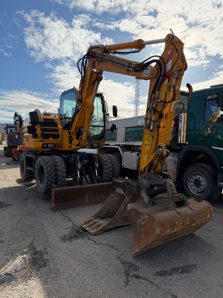 2012 New Holland MH 2.6 wheel excavator, front three-quarter view 2012 New Holland MH 2.6 wheel excavator, front three-quarter view