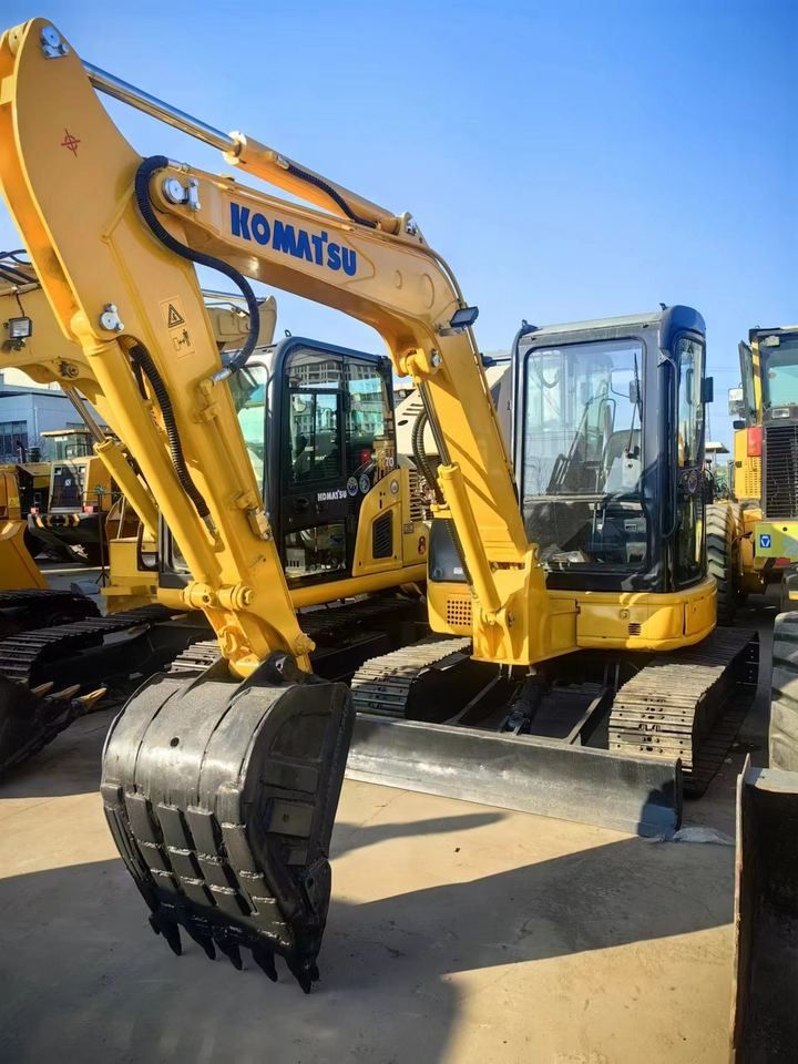 Komatsu PC55MR-5 mini excavator, front three-quarter view Komatsu PC55MR-5 mini excavator, front three-quarter view