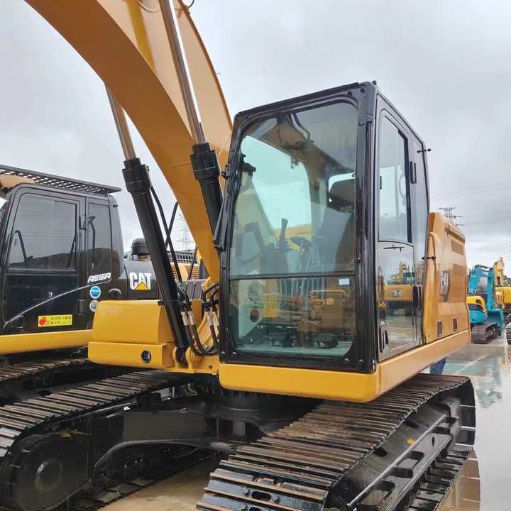 Caterpillar 320GC crawler excavator, side view of cab and boom