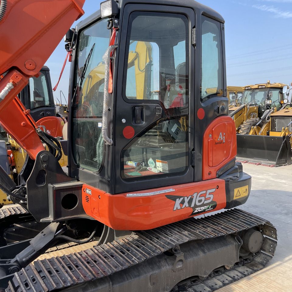 Kubota KX165-5 mini excavator, side view of the cab