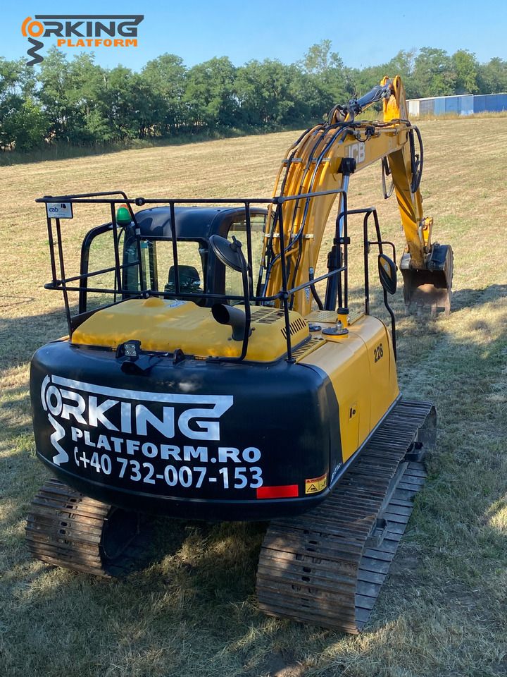 2019 JCB JS131LC excavator, rear three-quarter view