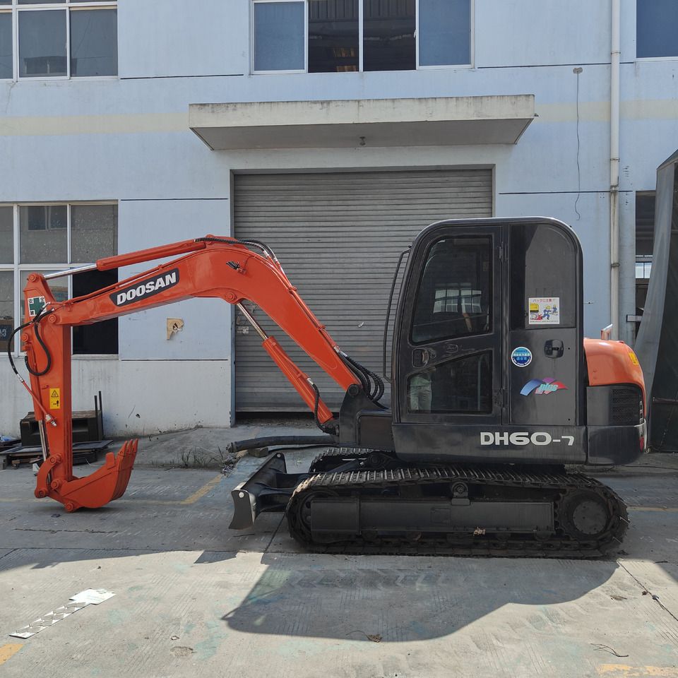 Doosan DH60-7 mini excavator, side view Doosan DH60-7 mini excavator, side view