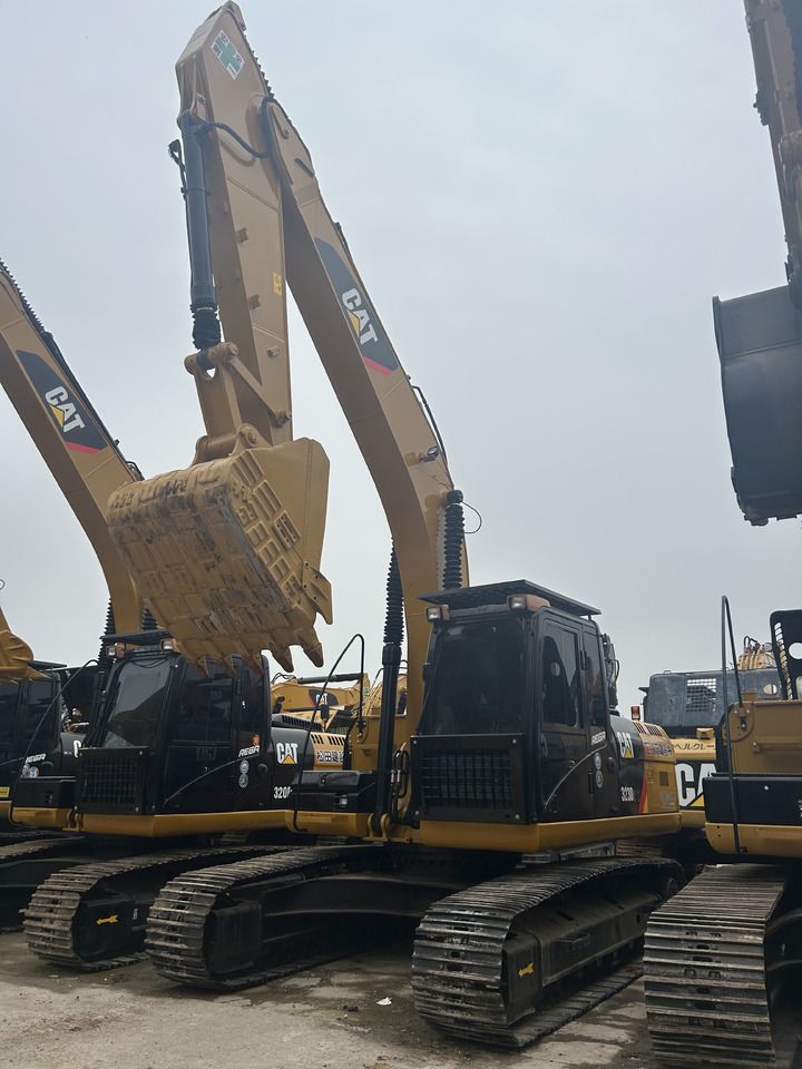 2024 Caterpillar 323D2L crawler excavator, front three-quarter view