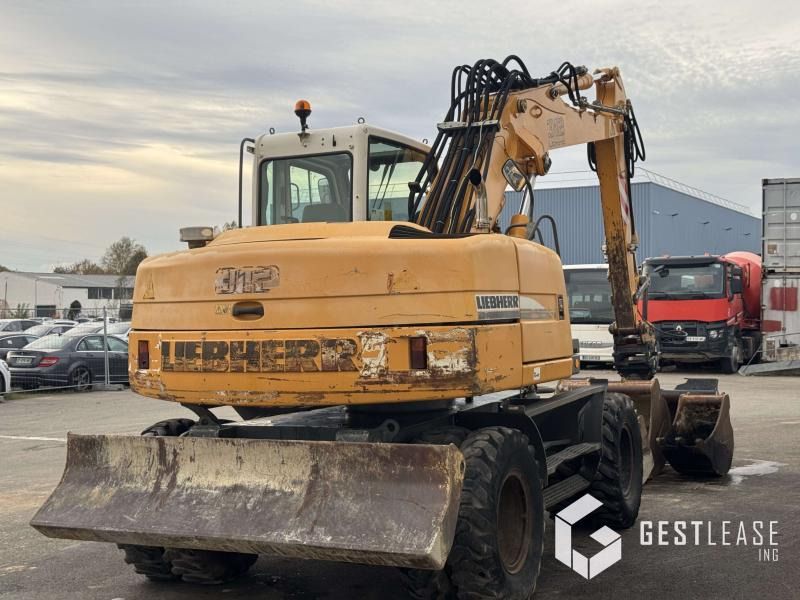 2004 Liebherr A312 wheel excavator rear view 2004 Liebherr A312 wheel excavator rear view