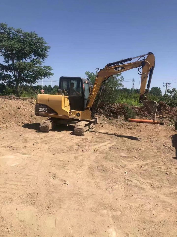 2020 Caterpillar 305.5 mini excavator, rear three-quarter view 2020 Caterpillar 305.5 mini excavator, rear three-quarter view