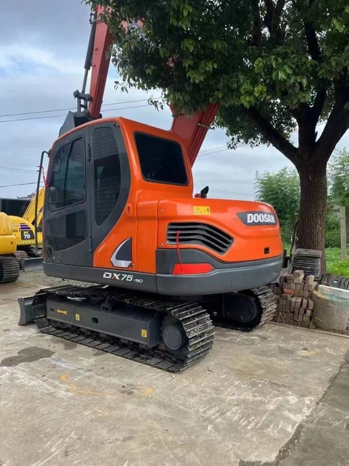 2024 Doosan DX75-9C mini excavator, rear three-quarter view