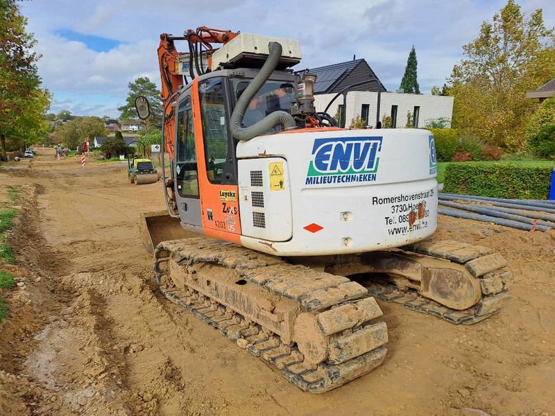2007 Hitachi ZX135US crawler excavator, rear three-quarter view 2007 Hitachi ZX135US crawler excavator, rear three-quarter view