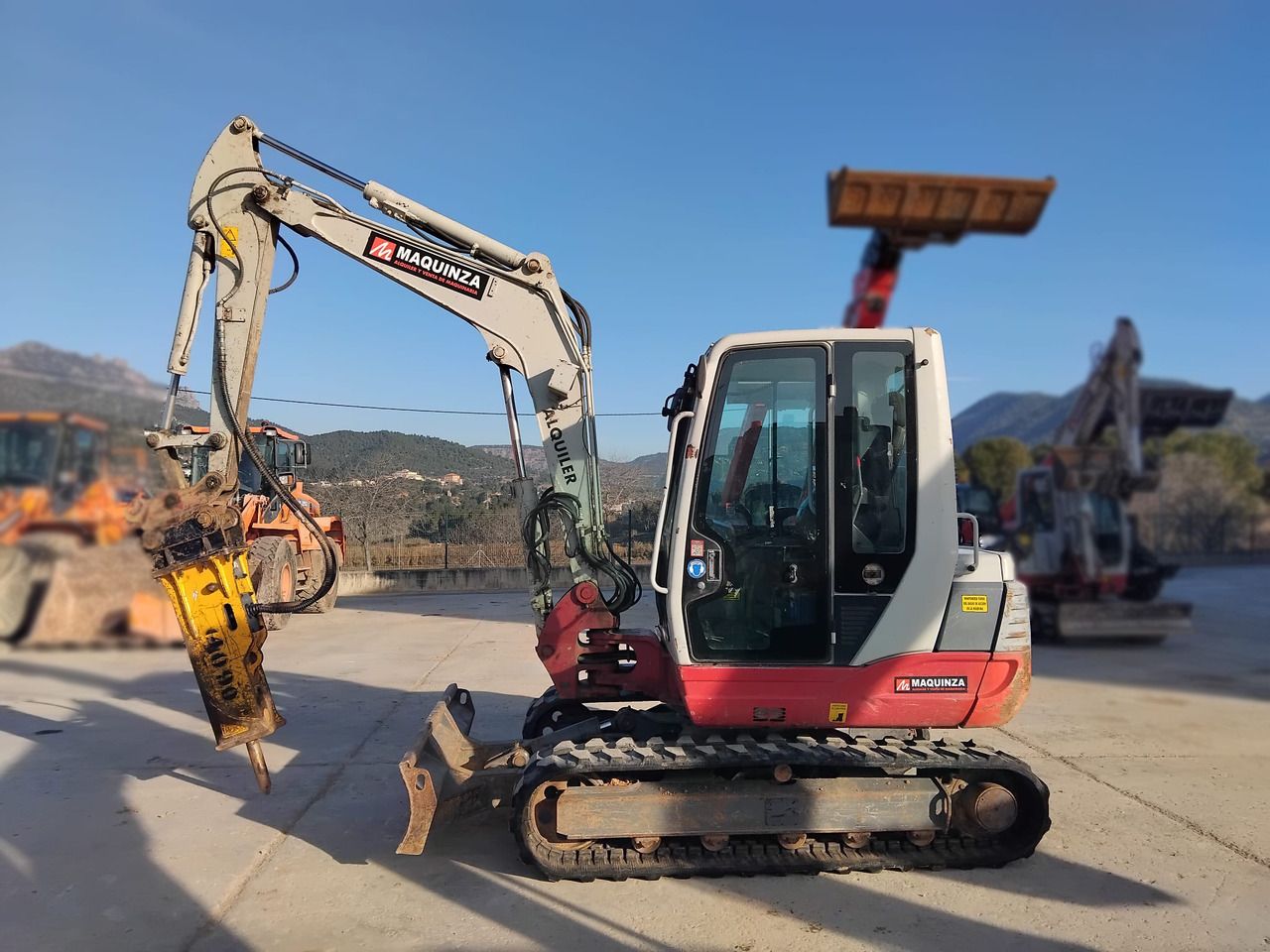 2019 Takeuchi TB250 mini excavator, side view with hydraulic breaker 2019 Takeuchi TB250 mini excavator, side view with hydraulic breaker