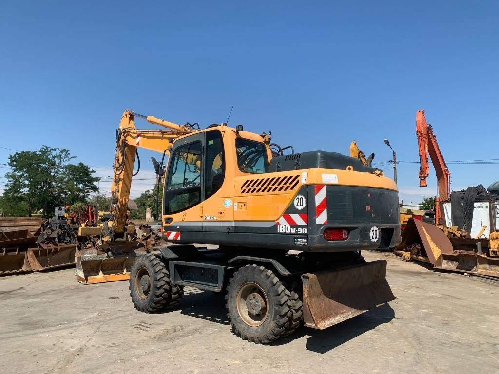 2014 Hyundai R180W-9A wheel excavator, rear three-quarter view 2014 Hyundai R180W-9A wheel excavator, rear three-quarter view
