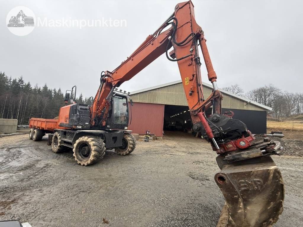 2013 Hitachi ZX140W-5 wheel excavator, front three-quarter view
