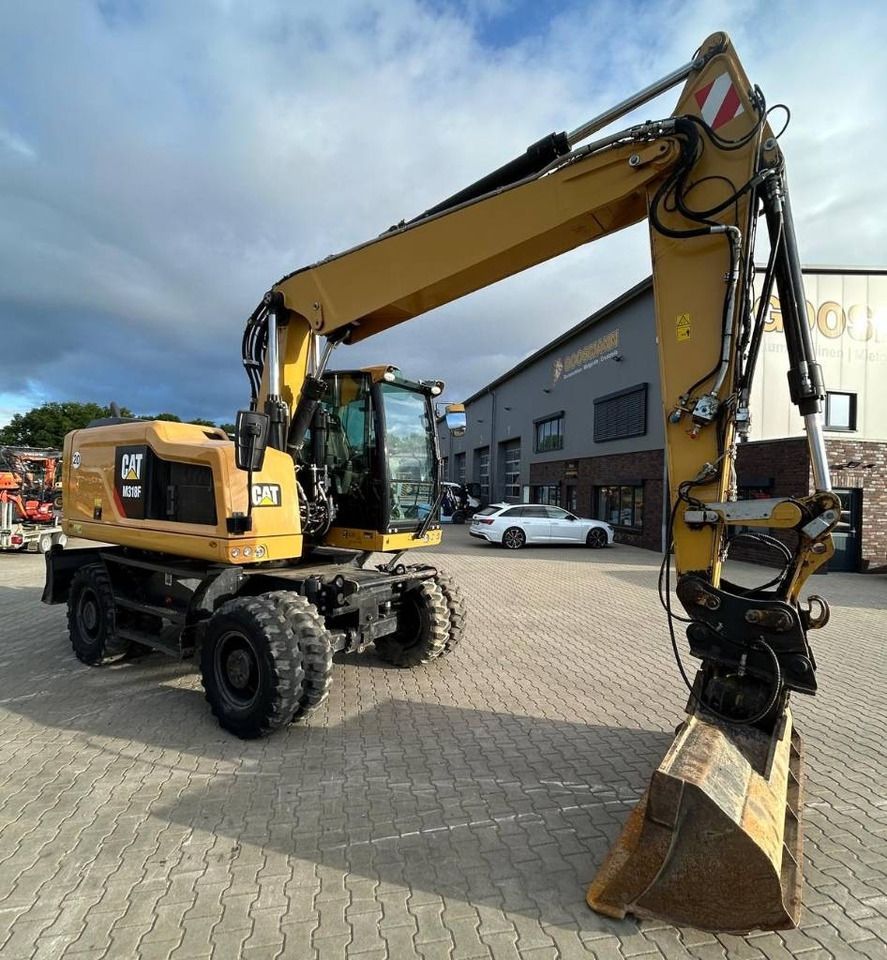2016 Caterpillar M318F wheel excavator, front three-quarter view 2016 Caterpillar M318F wheel excavator, front three-quarter view