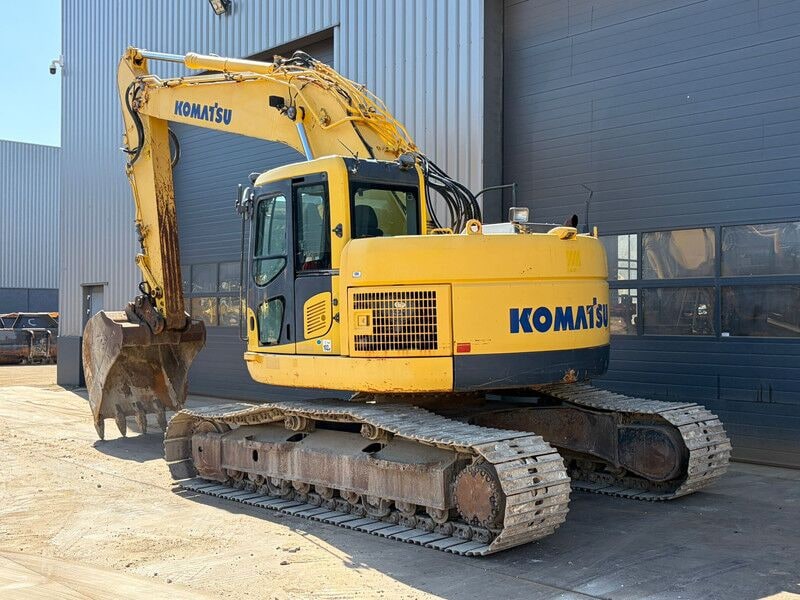 2012 Komatsu PC228USLC-8 crawler excavator, rear three-quarter view 2012 Komatsu PC228USLC-8 crawler excavator, rear three-quarter view
