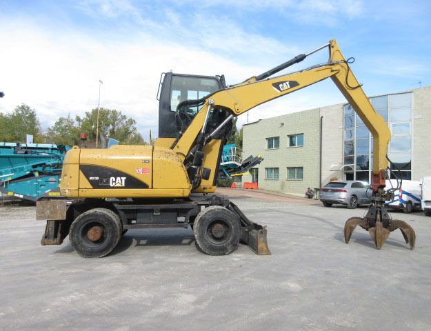 2009 Caterpillar M313D material handler, side view 2009 Caterpillar M313D material handler, side view