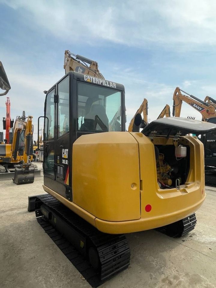 2024 Caterpillar 305.5E2 mini excavator, rear three-quarter view 2024 Caterpillar 305.5E2 mini excavator, rear three-quarter view