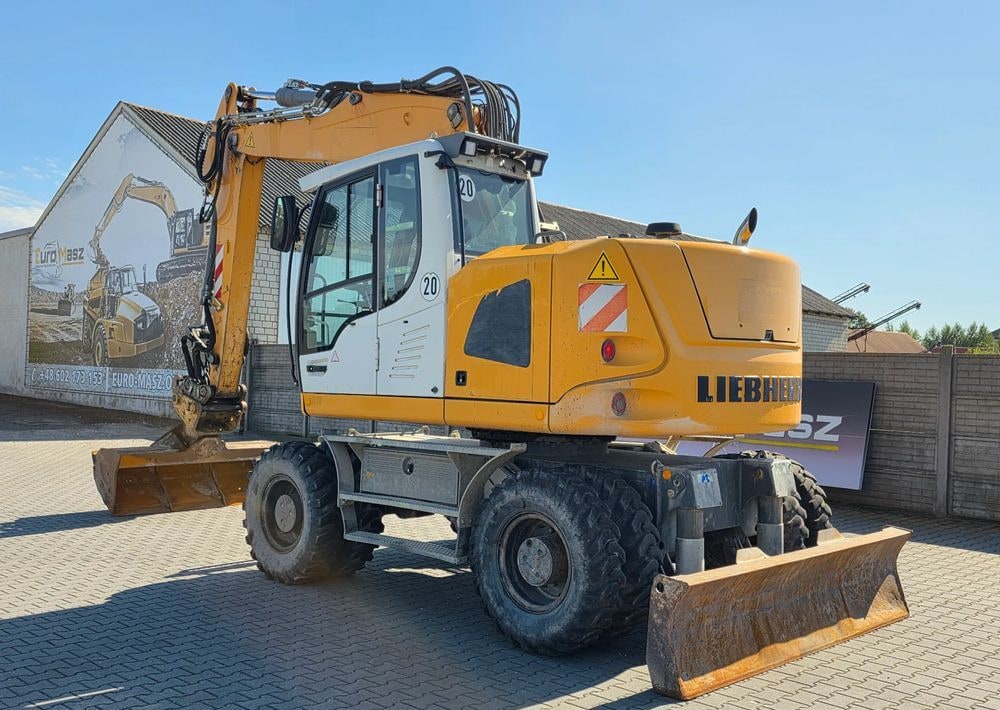 2014 Liebherr A918 COMPACT wheel excavator, rear three-quarter view 2014 Liebherr A918 COMPACT wheel excavator, rear three-quarter view