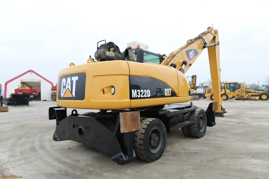2008 Caterpillar M322D material handler, rear three-quarter view 2008 Caterpillar M322D material handler, rear three-quarter view