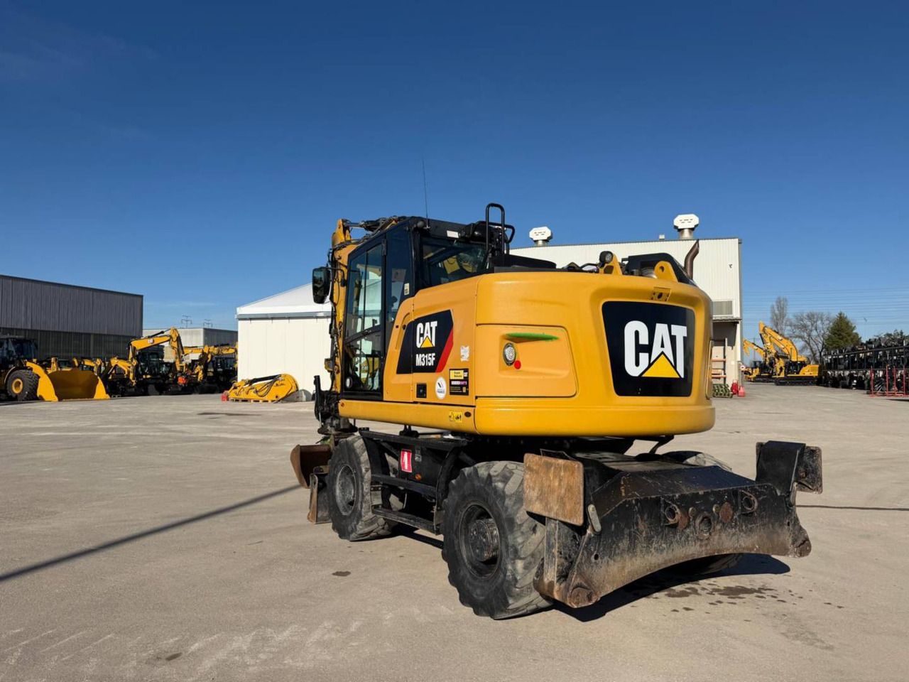 2019 Caterpillar M315F wheel excavator, rear three-quarter view