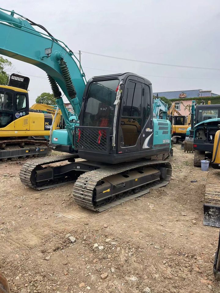 2024 Kobelco SK140 crawler excavator, front three-quarter view