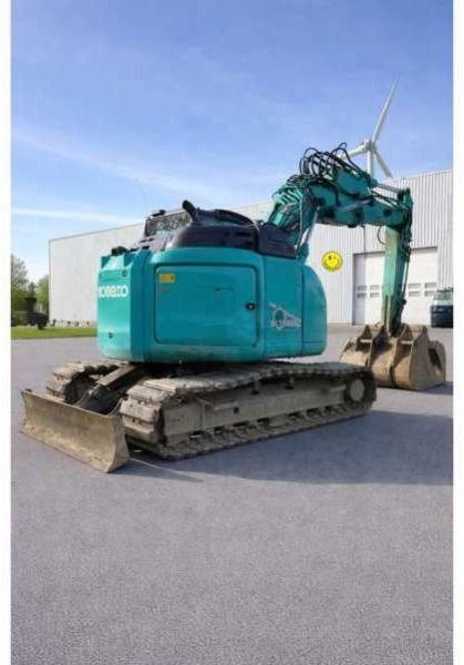 2016 Kobelco SK140SRLC-5 crawler excavator, rear three-quarter view 2016 Kobelco SK140SRLC-5 crawler excavator, rear three-quarter view